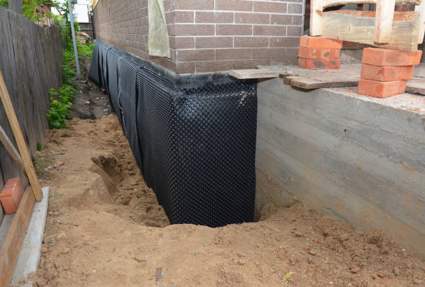 SJ Waterproofing Pros technician performing targeted Basement Waterproofing assessment in Westover, AL